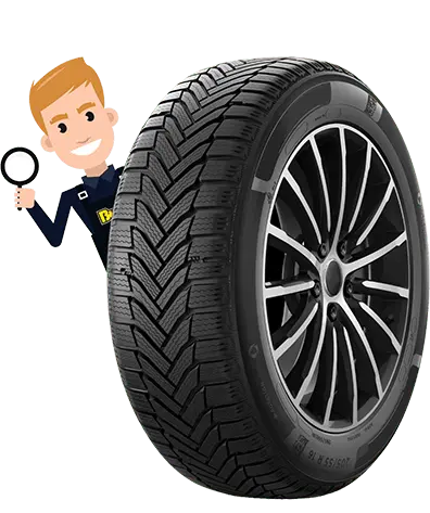 A tyre with a man poking out the top holding a magnifying glass